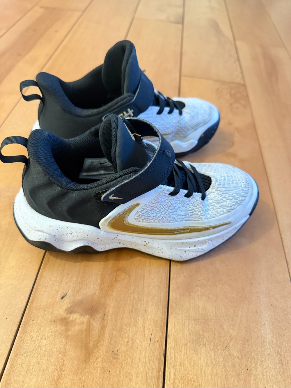 Nike Kids White Black Sneakers with Gold Swoosh